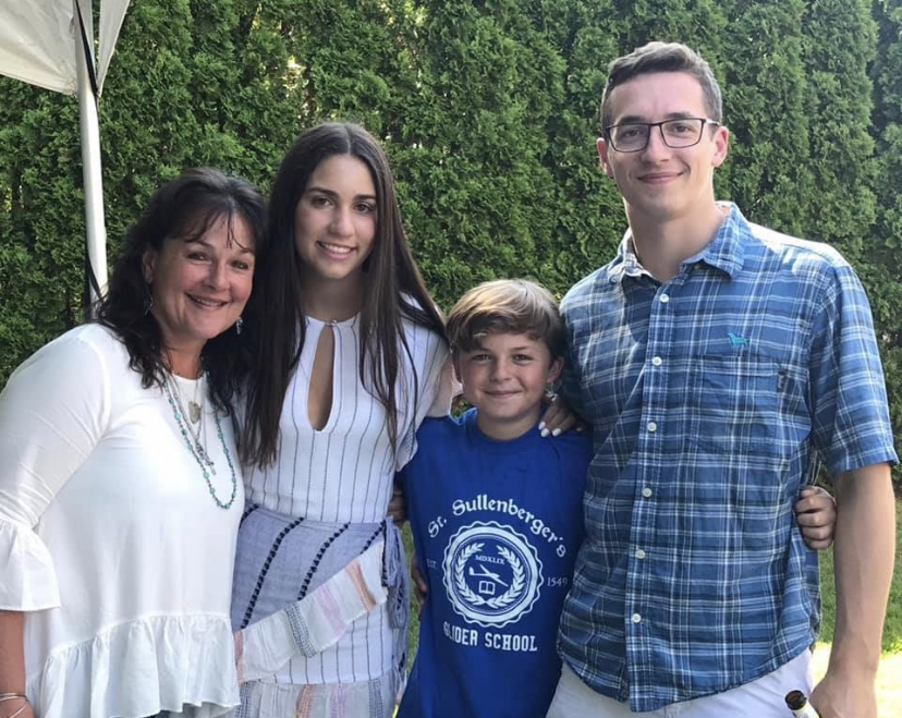 My Aunt Adele, cousin Mikey, Andrew, and I celebrating my high school graduation